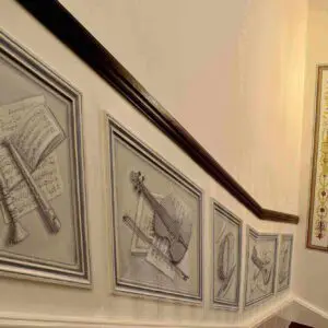 A staircase adorned with vibrant pictures, showcasing the work of some of the best mural artists in the UK.